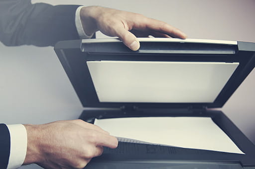 hand of businessman scanning a document